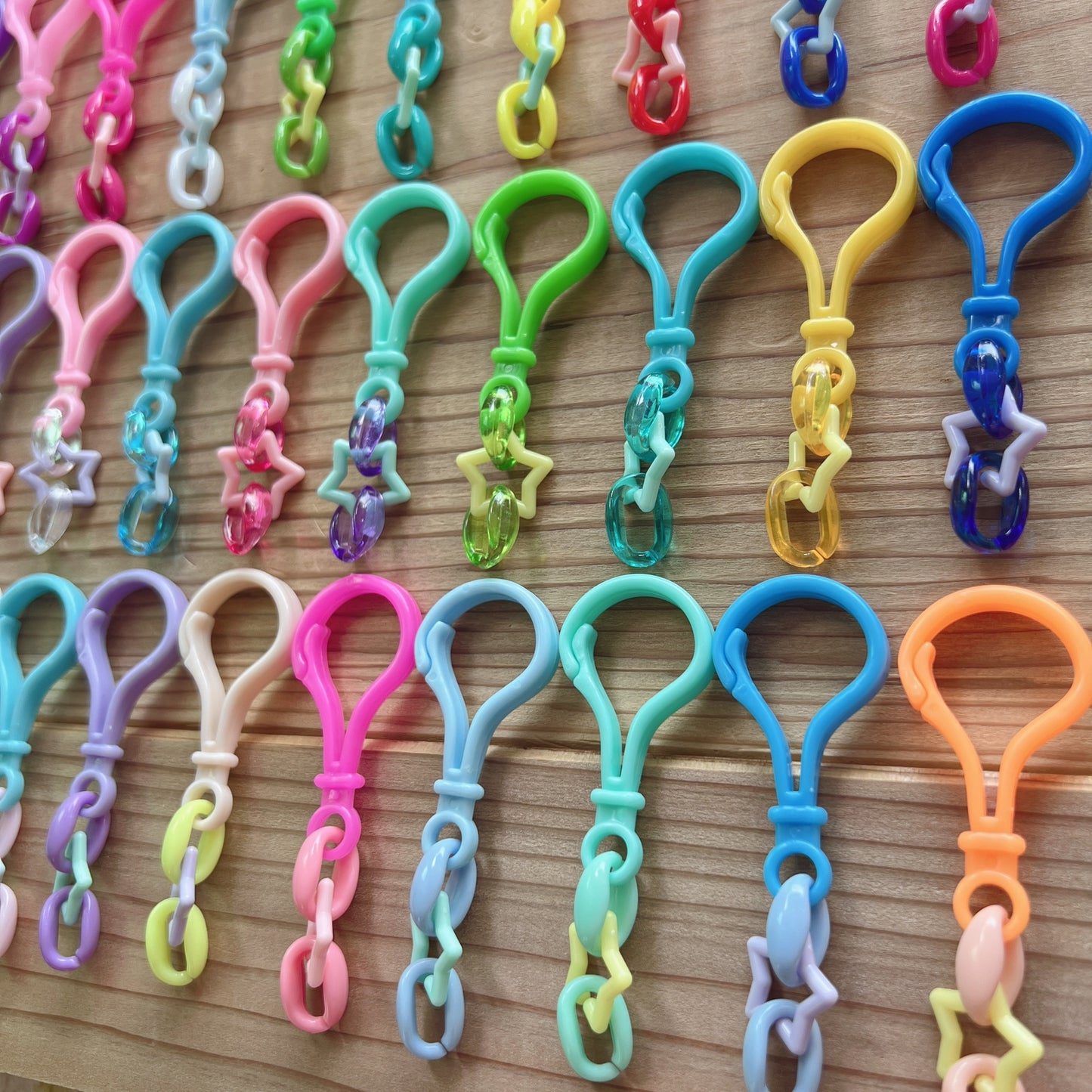 234 星チェーン おまかせ100個セット キャンディバッグキーホルダー ハンドメイド ガチャ詰めポーチ ワークショップ 材料 ハトメがカラーです♡